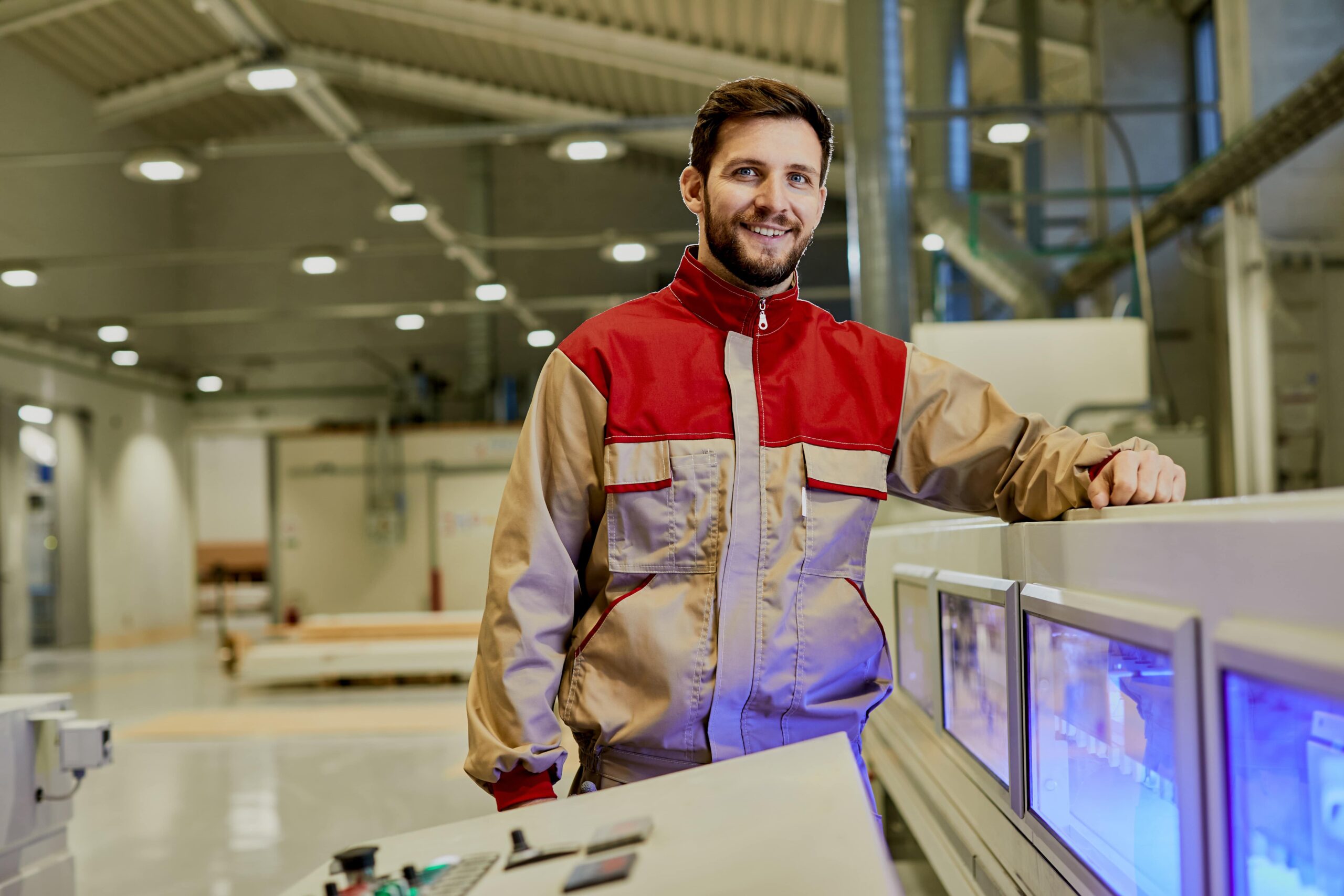 portrait-happy-machine-operator-woodworking-factory-min